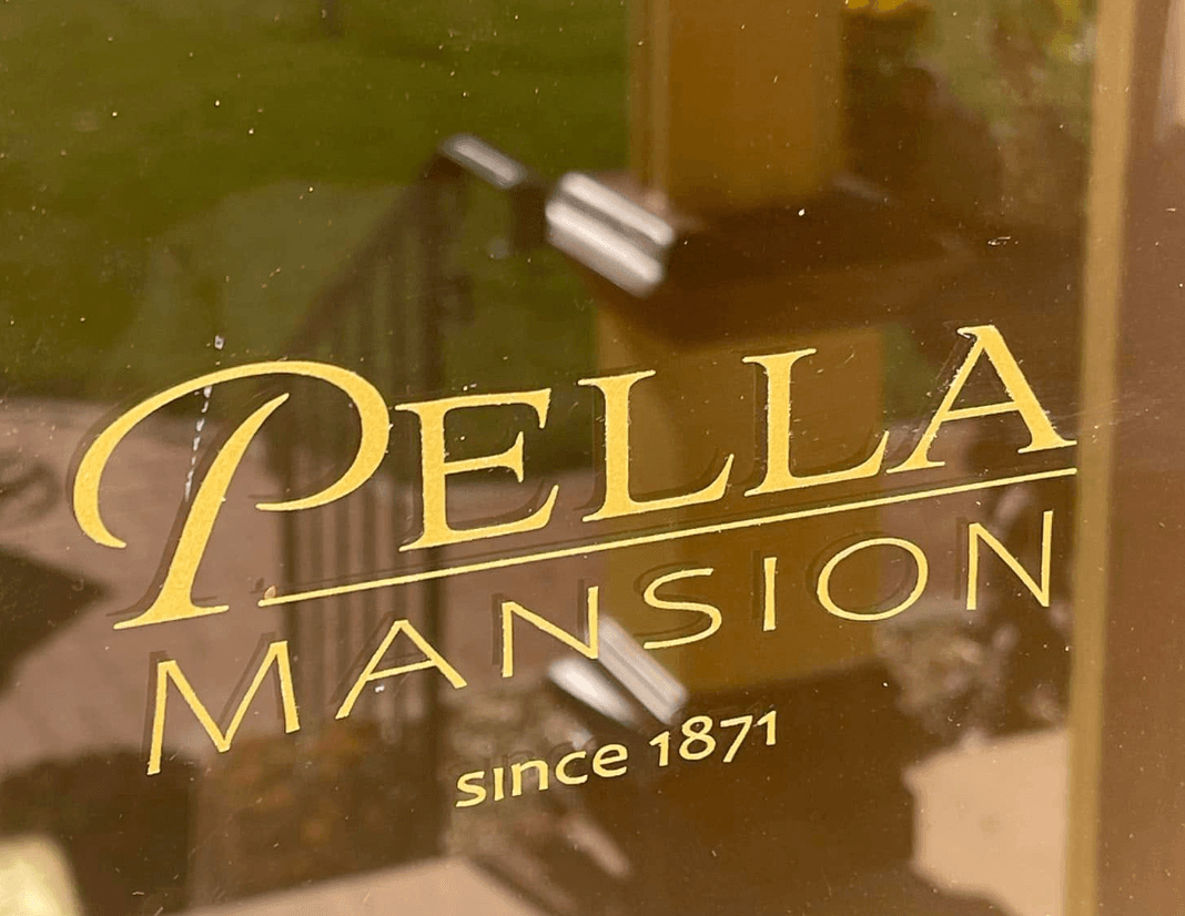 Pella Mansion Entrance and Logo